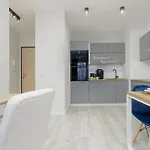Dark Blue And Grey Apartment With Pastel Bedroom In Warsaw By Noclegi Renters
