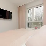 Dark Blue And Grey Apartment With Pastel Bedroom In Warsaw By Noclegi Renters