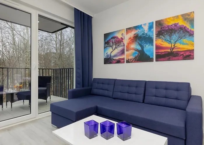 Dark Blue And Grey Apartment With Pastel Bedroom In Warsaw By Noclegi Renters